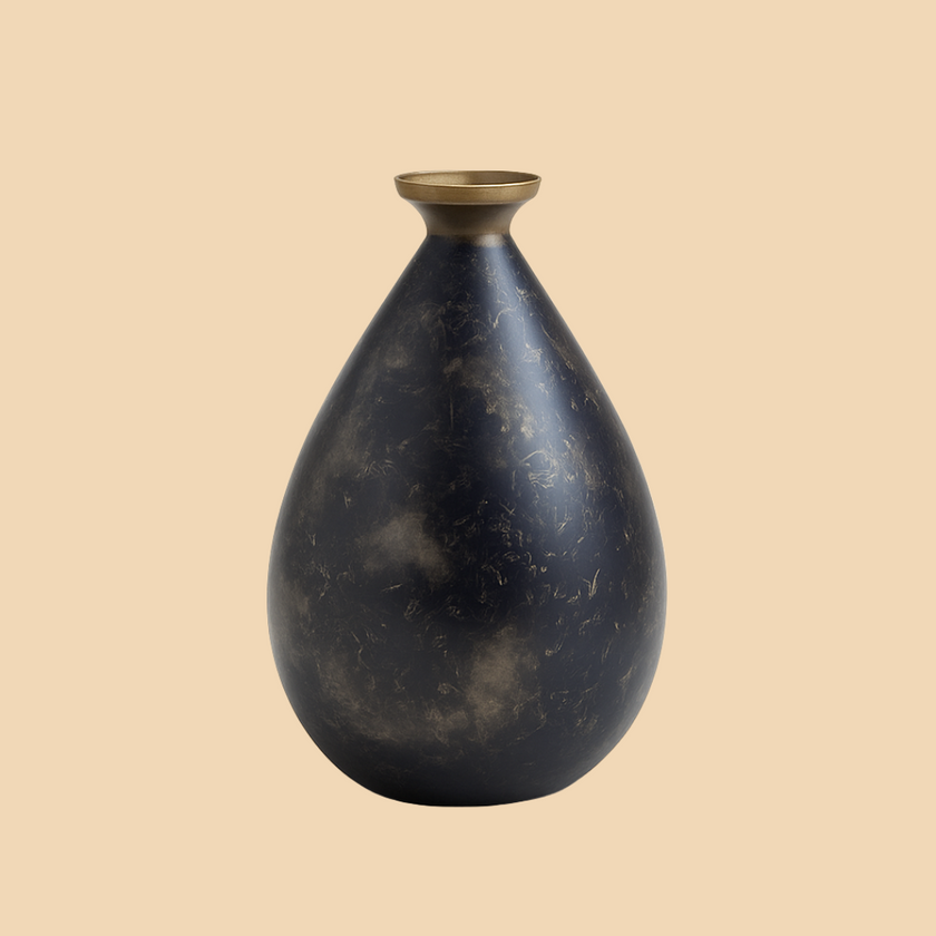 Black marble vase with gold accent on a beige background