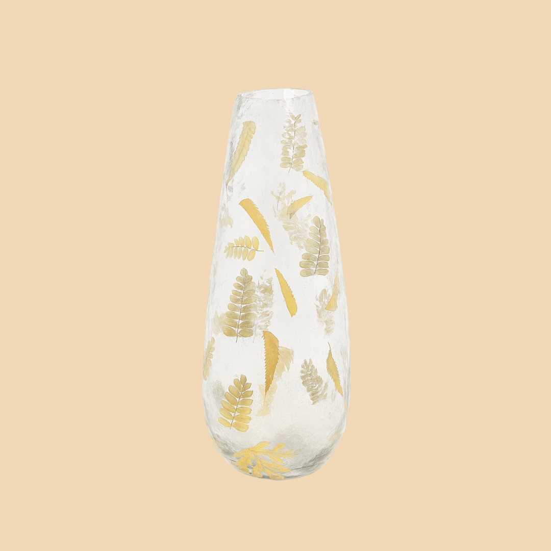 Decorative vase with gold leaf pattern on a beige background