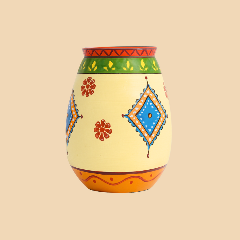 Decorative vase with colorful patterns on a beige background