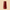 Red glass vase on a beige background