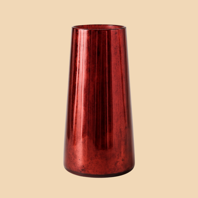 Red glass vase on a beige background