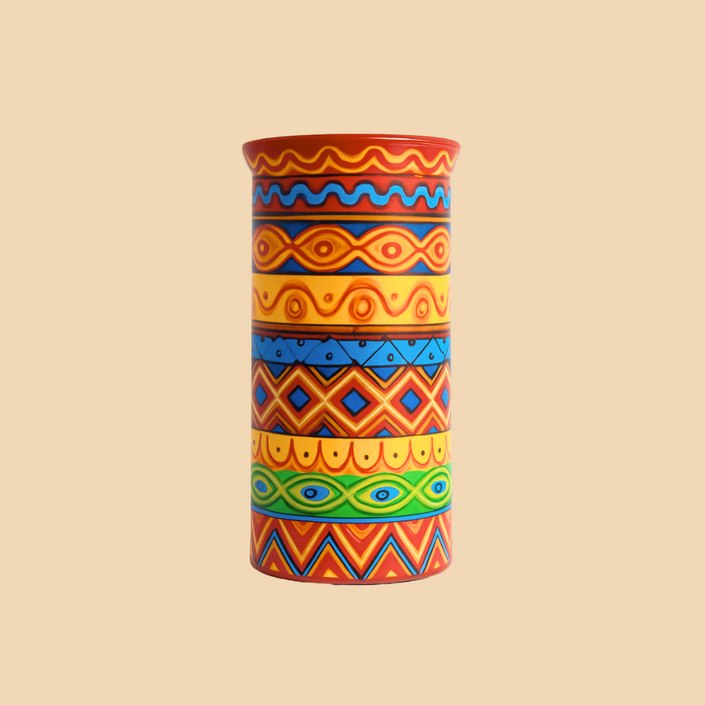 Colorful patterned vase on a beige background